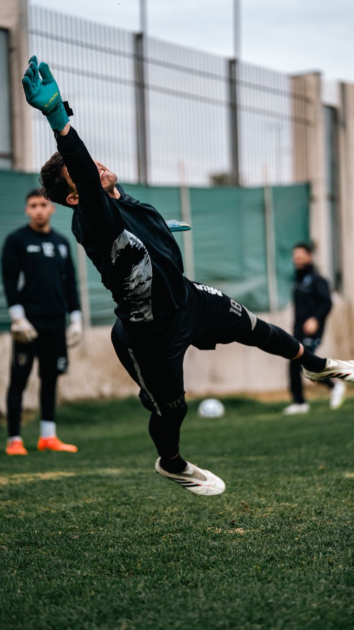 Mastering the First Impression: Your intriguing post title goes here Goalkeeper in action during a soccer training session, showcasing agility and focus.